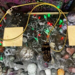 Chinese Black Foo Dog Pendant With Light Green Cord